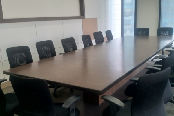 A spacious, premium boardroom at Infinity Business Centre, equipped with a long conference table and multiple ergonomic chairs, perfect for hosting high-level corporate meetings, presentations, and board meetings.