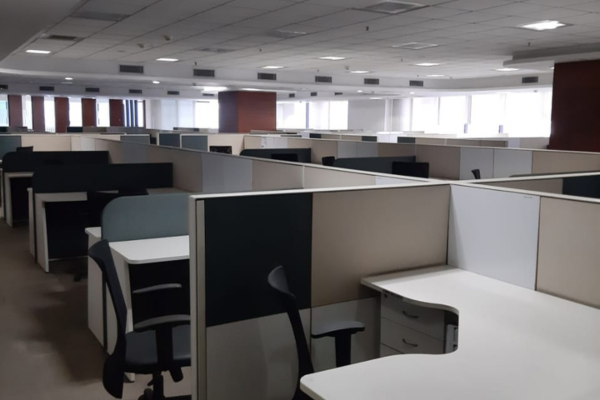 Spacious and well-lit office floor with ergonomic workstations and ample storage at Infinity Business Centre, designed for productivity and comfort.